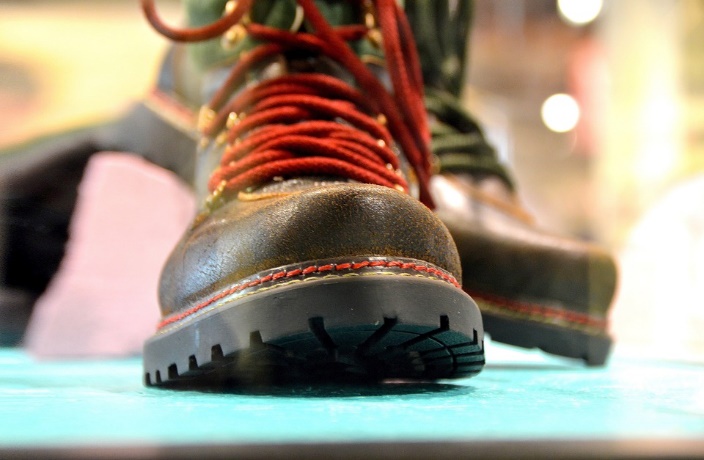 brown combat boot with red laces