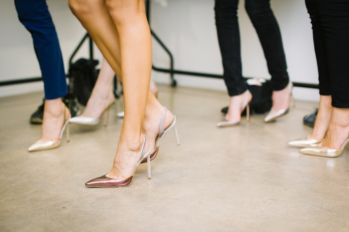 group of womens legs in stilettos