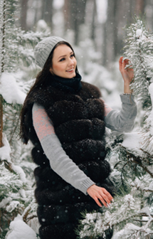 Girl in winter fur vest