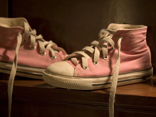 untied pink converse shoes